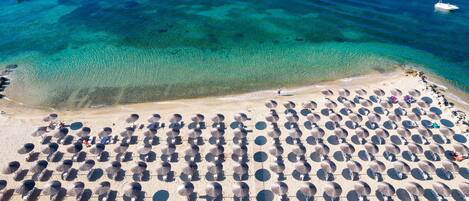 On the beach, sun loungers, beach umbrellas, scuba diving