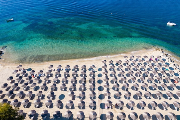 On the beach, sun loungers, beach umbrellas, scuba diving