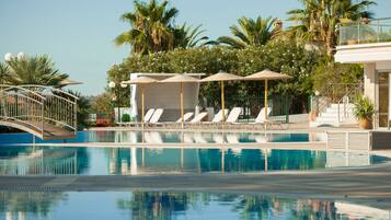 Indoor pool, seasonal outdoor pool, pool umbrellas, pool loungers