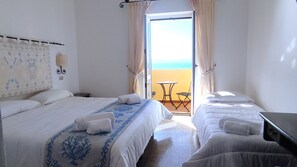 Deluxe Triple Room, Sea View | Minibar, in-room safe, desk, free WiFi - Hotel Castello (Golfo Aranci)
