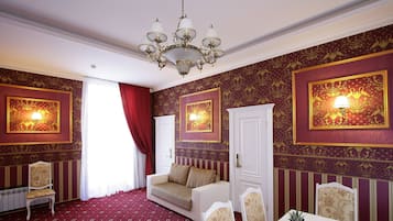 Luxury Room | Living area | 32-inch LCD TV with satellite channels, TV