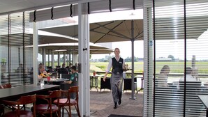 A restaurant with a modern interior, large windows, and a view of the outdoors. - Best Western Plus Hotel Restaurant Aduard (Aduard)