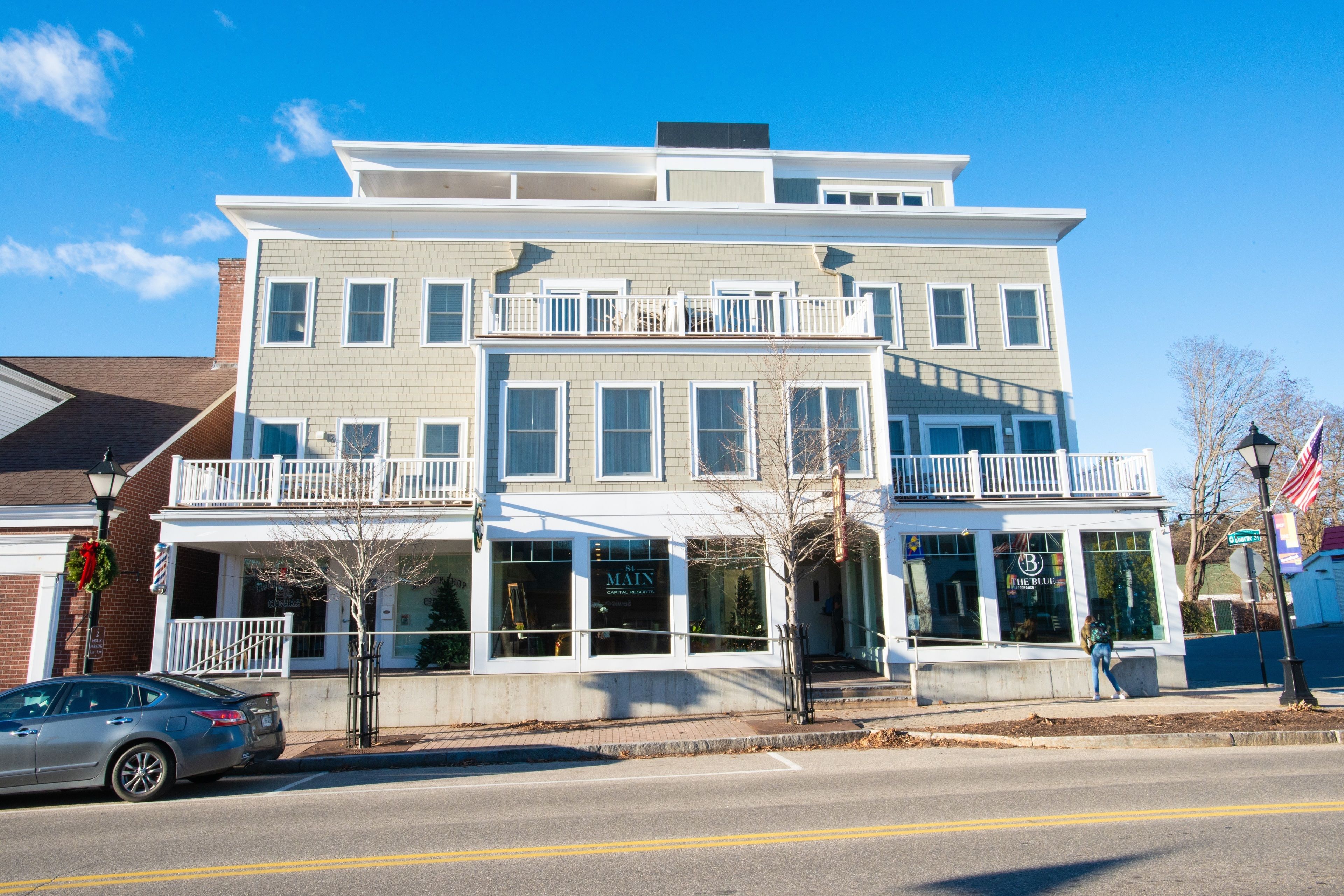 A two-story building with a ground-floor commercial space and upper residential units.