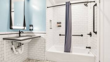 Deluxe Room, 1 King Bed, Accessible, Bathtub (Mobility & Hearing) | Bathroom | Free toiletries, hair dryer, towels
