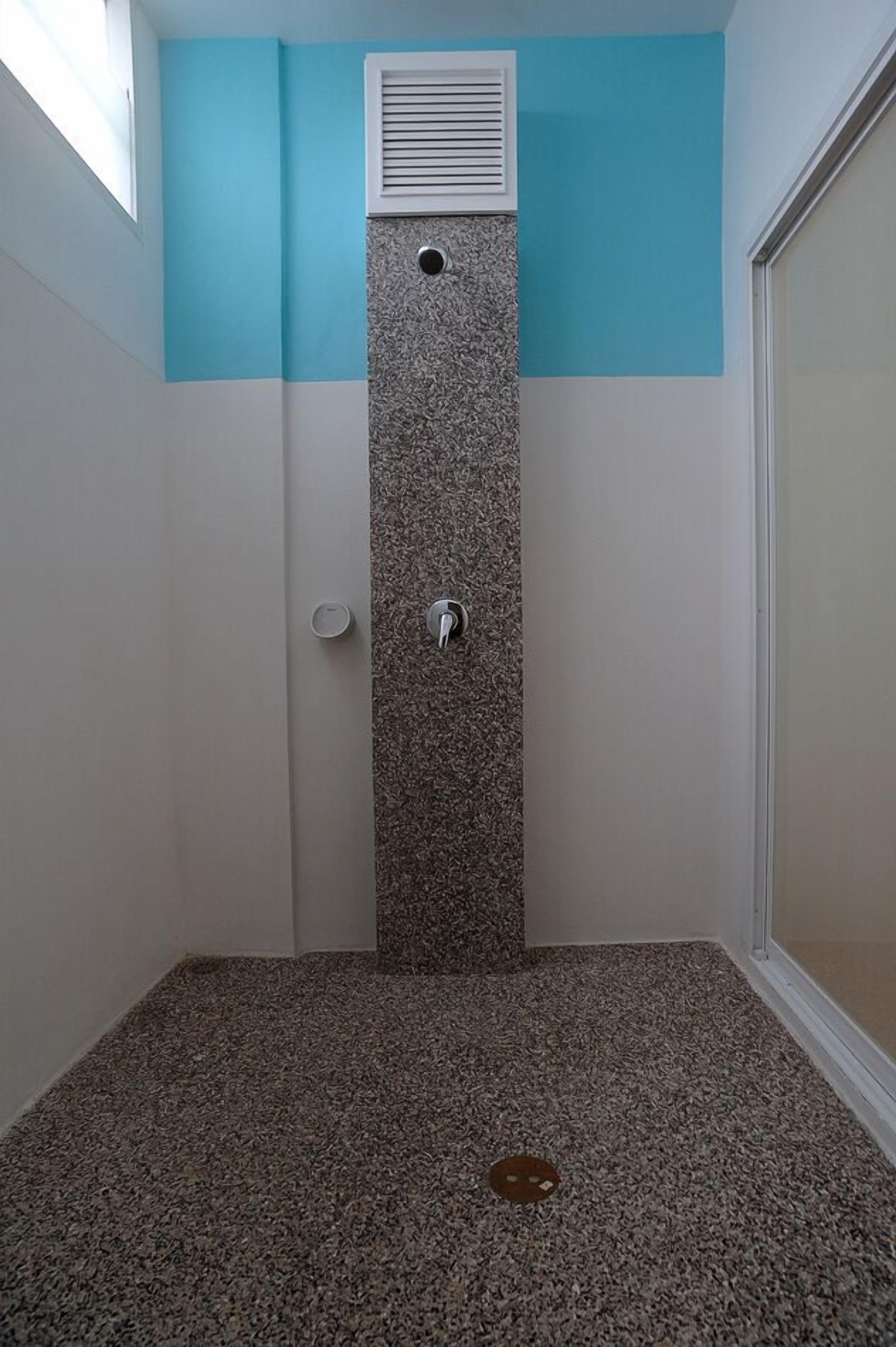 deluxe room | bathroom | shower, rainfall showerhead, free toiletries, hair dryer