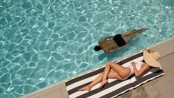 Outdoor pool, free pool cabanas, pool umbrellas