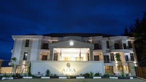 A large, modern hotel with a prominent entrance and a sign reading "ALBA". - Alba Hotel Meru (Meru)