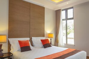 Habitación Deluxe | Ropa de cama de alta calidad, minibar, caja fuerte