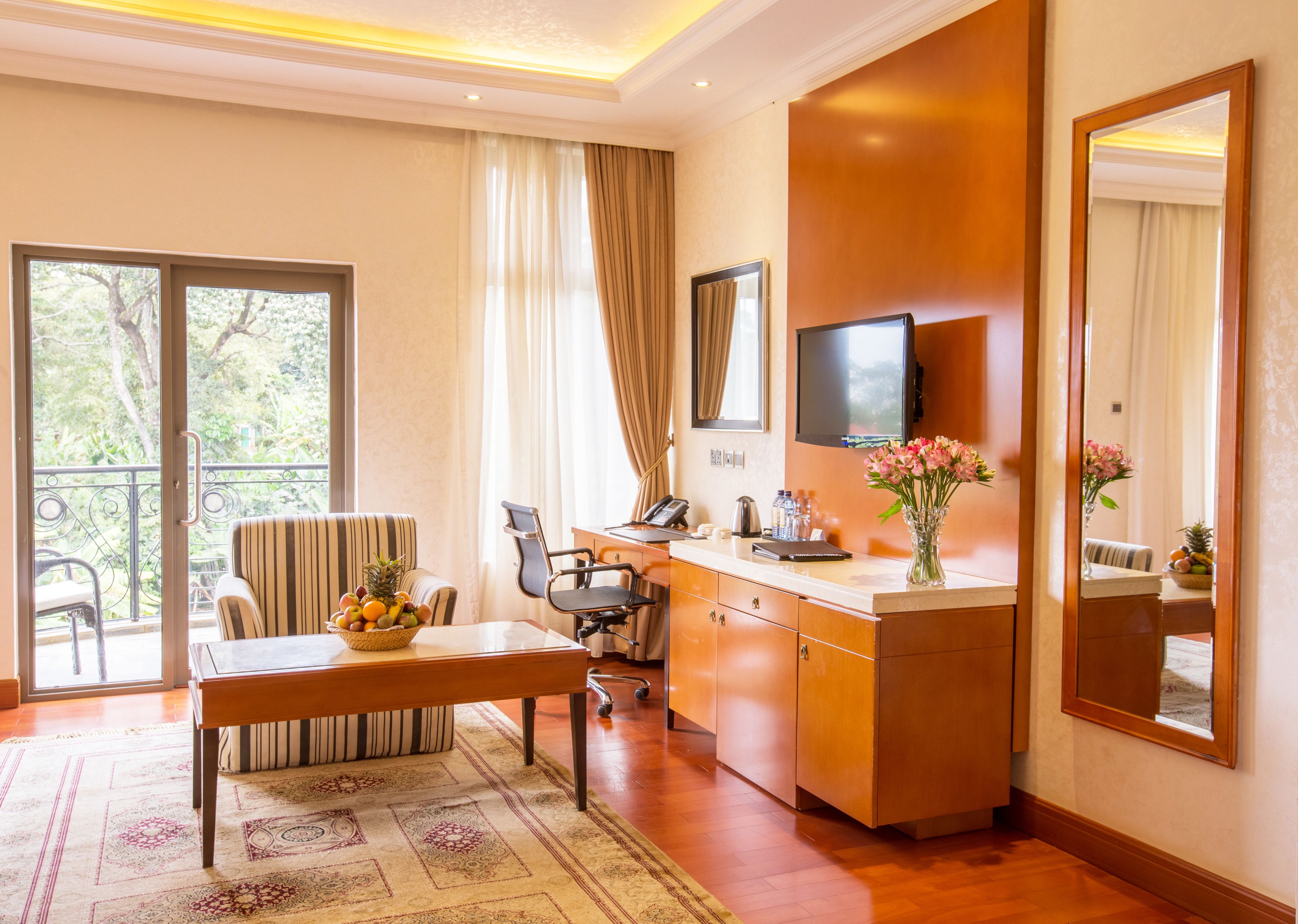 deluxe room | living area | 32-inch tv with satellite channels