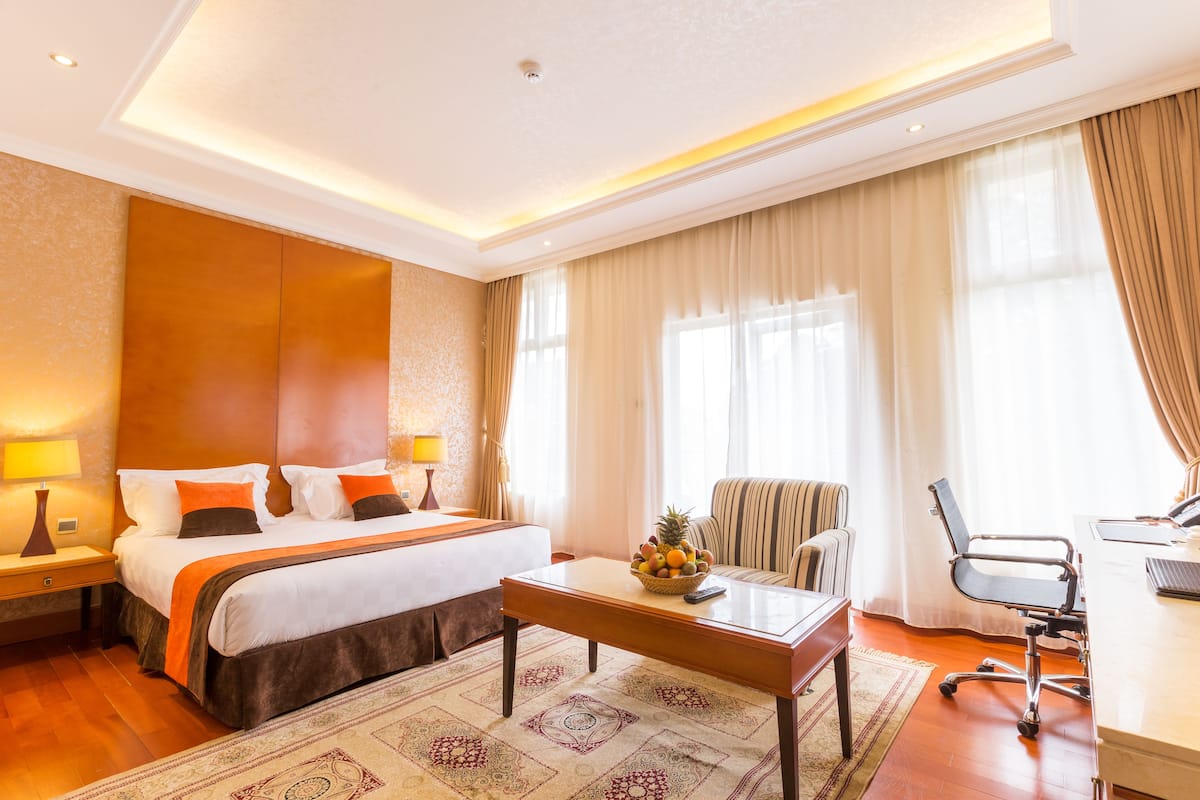 deluxe room | 1 bedroom, premium bedding, minibar, in-room safe