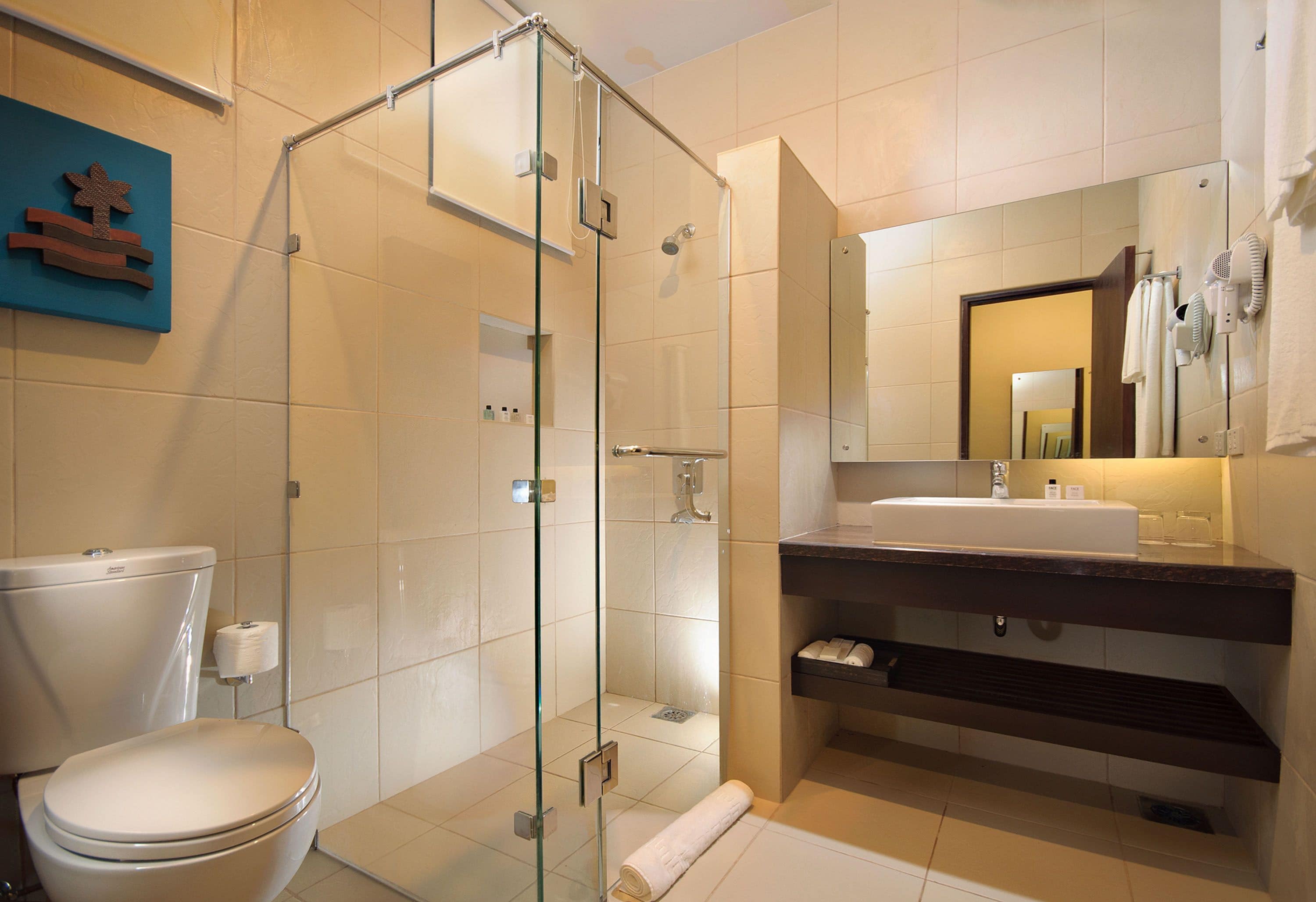 deluxe double or twin room beach front | bathroom | shower, free toiletries, hair dryer, towels