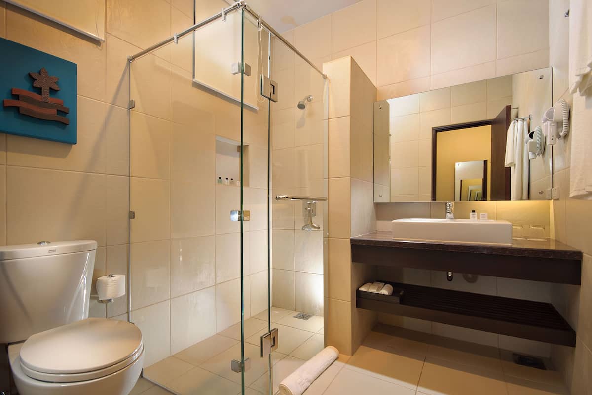 deluxe double or twin room beach front | bathroom | shower, free toiletries, hair dryer, towels