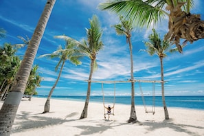 Private beach, white sand, sun loungers, beach umbrellas