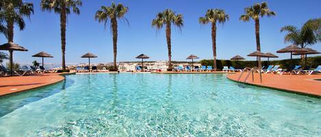 Outdoor pool, pool umbrellas, sun loungers