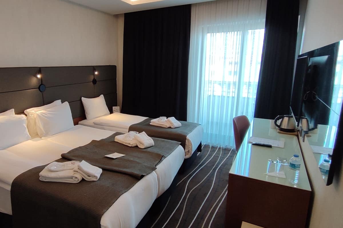 Premium Triple Room | 1 slaapkamer, luxe beddengoed, een minibar, een kluis op de kamer