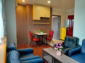 Superior Apartment | Living area | 40-inch LED TV with cable channels, TV - Hotel Grand United Ahlone Branch (Yangon)