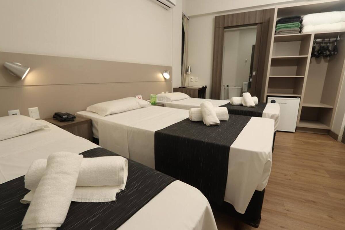 Standard Triple Room, 3 Single Beds | Minibar, in-room safe, desk, blackout curtains