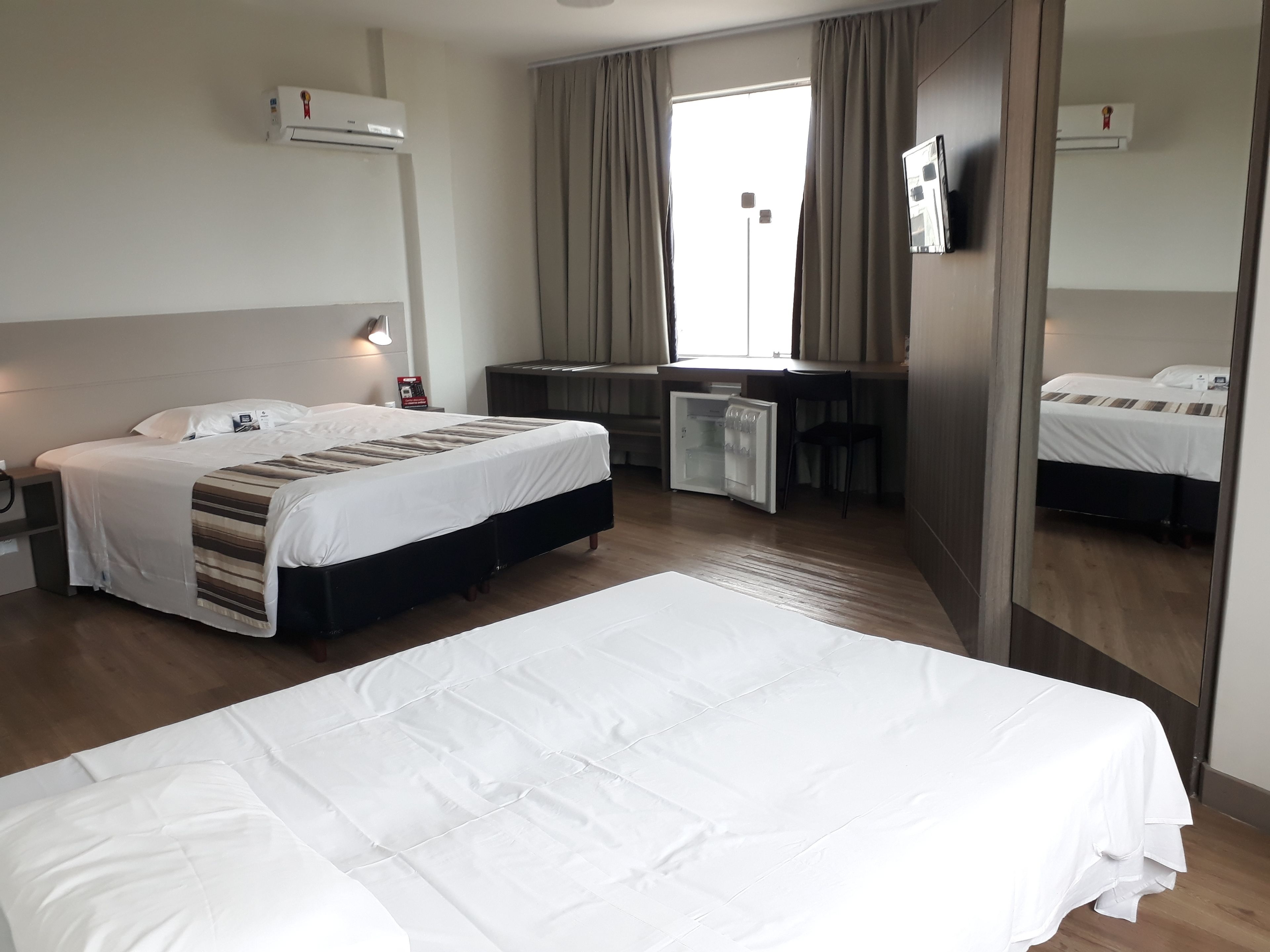 standard triple room | minibar, in-room safe, desk, blackout curtains