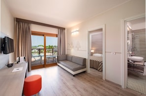 In-room safe, desk, laptop workspace, bed sheets