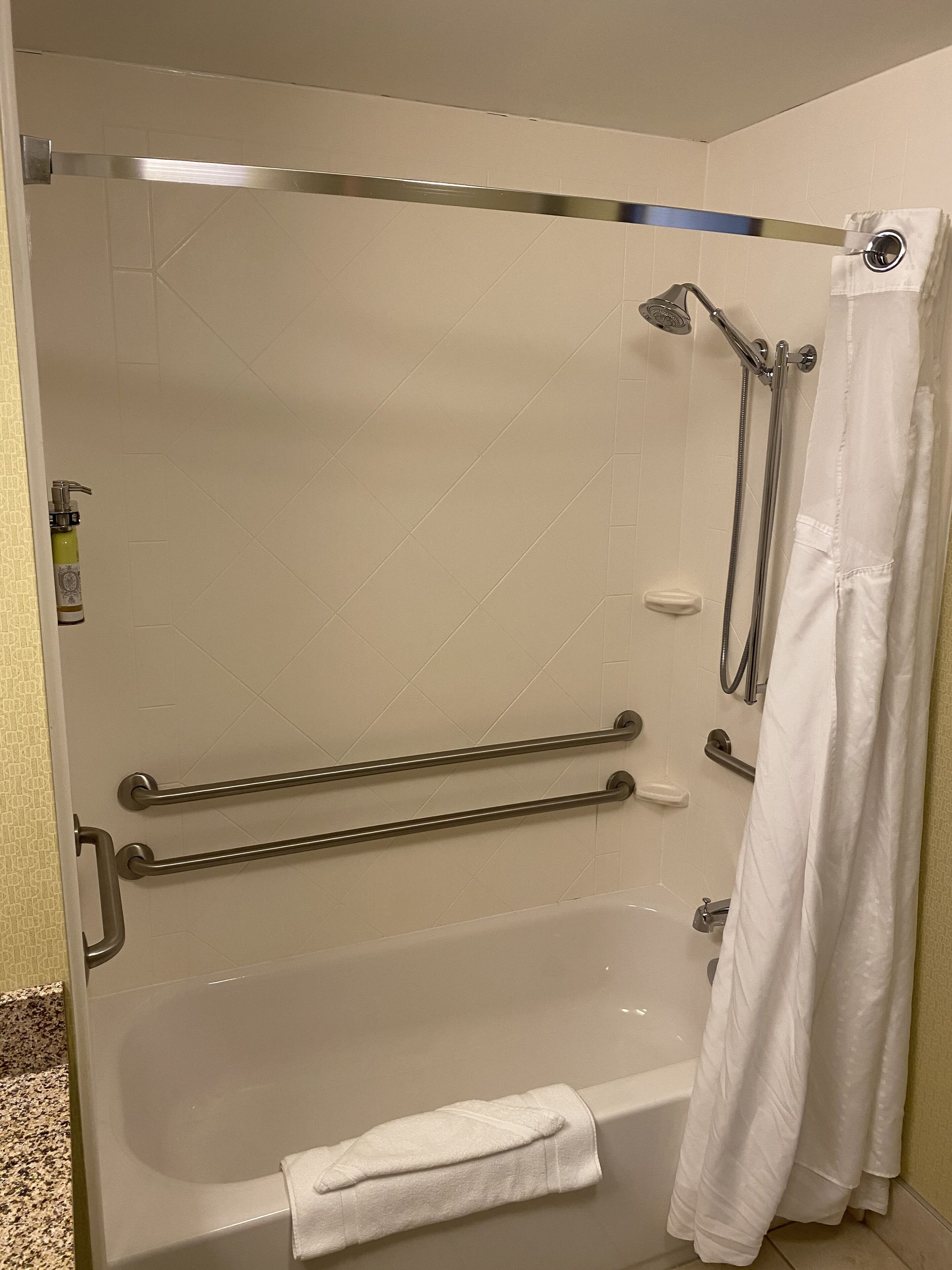 bathtub, free toiletries, hair dryer, towels