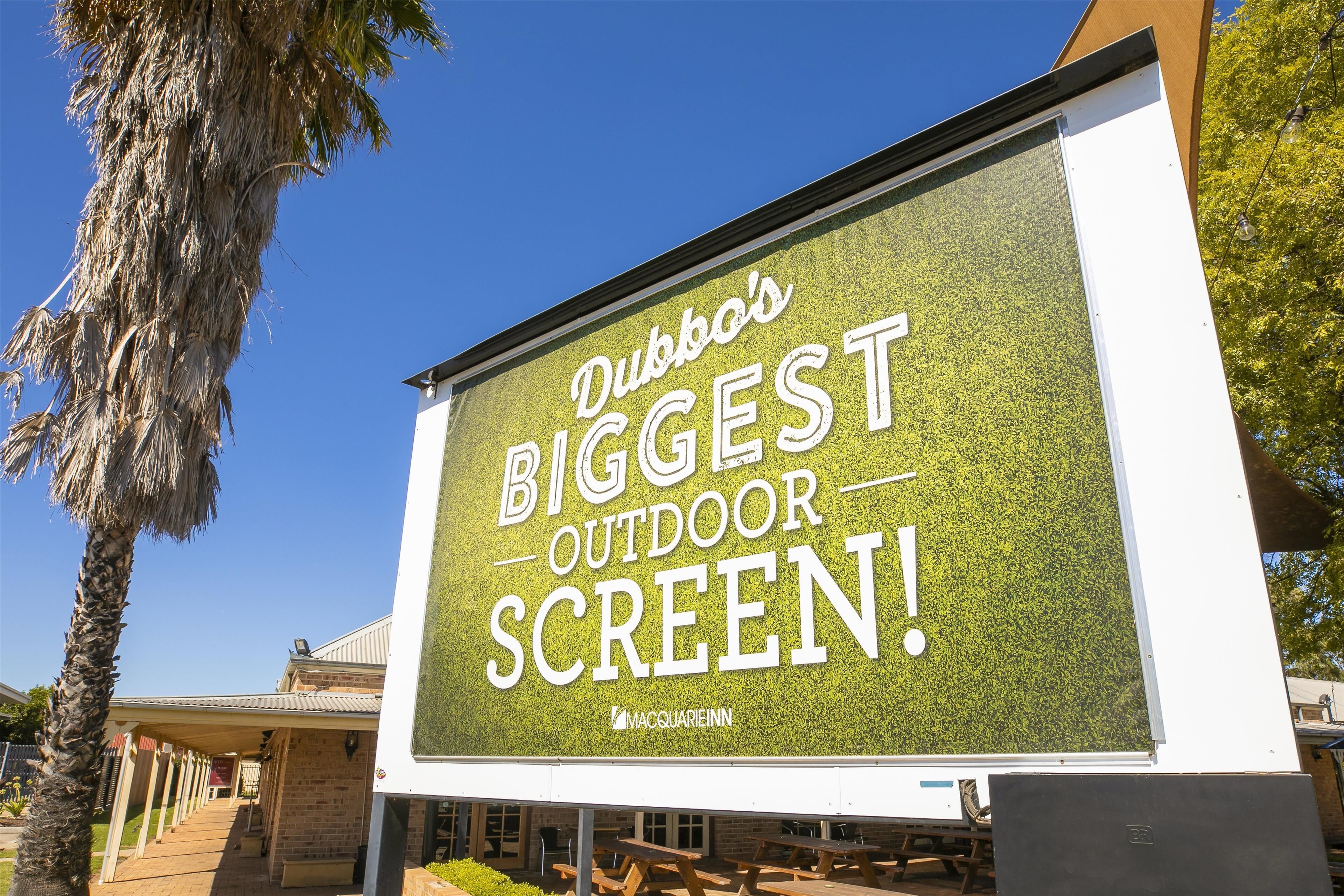 A billboard advertising Dubbo's Biggest Outdoor Screen.