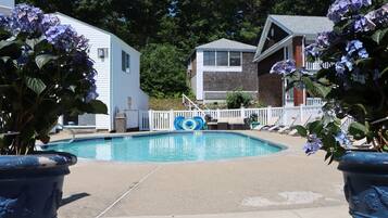 Seasonal outdoor pool, open 9 AM to 9 PM, pool umbrellas, pool loungers