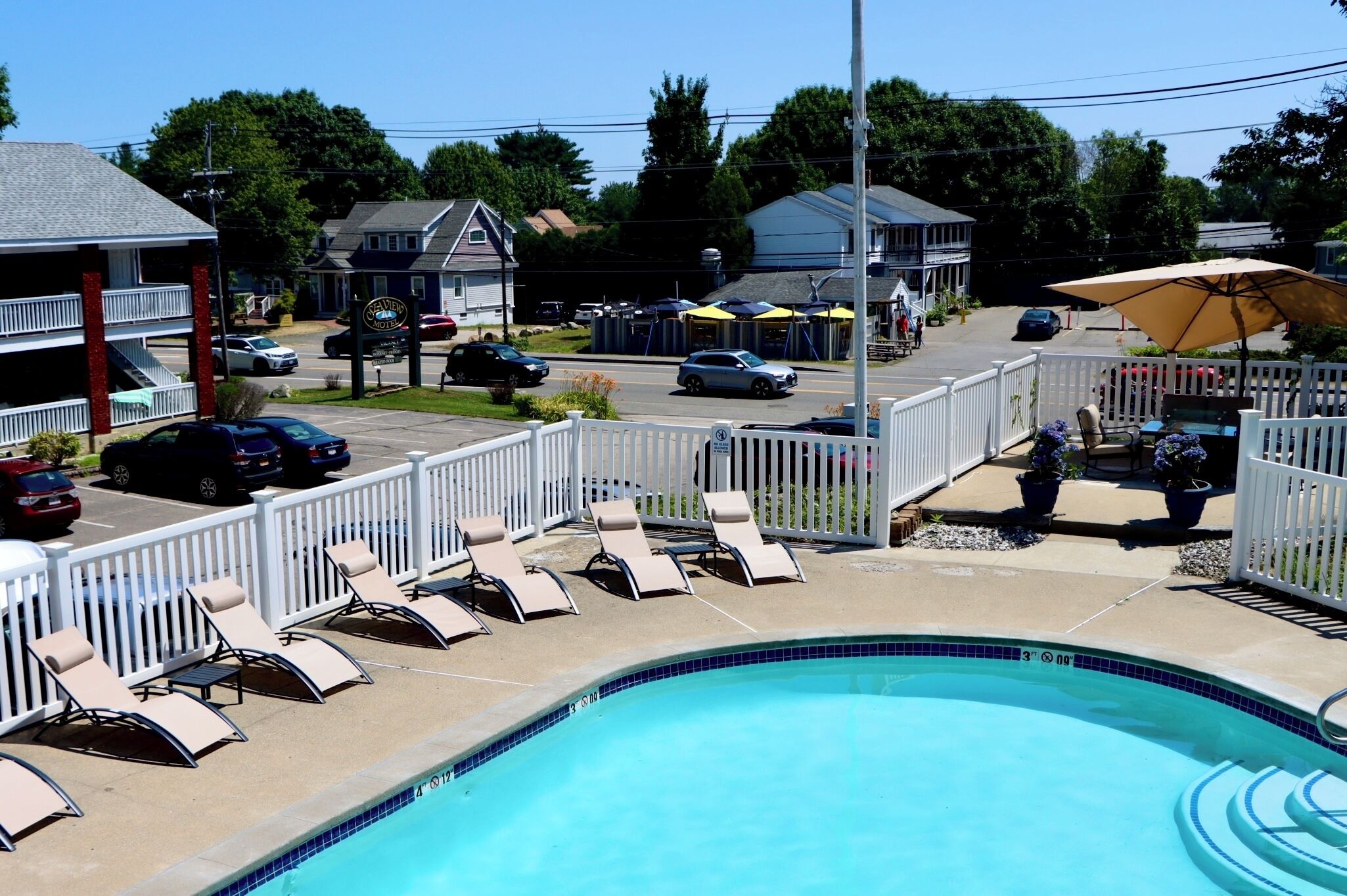 Seasonal outdoor pool, open 9 AM to 9 PM, pool umbrellas, sun loungers