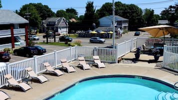 Seasonal outdoor pool, open 9 AM to 9 PM, pool umbrellas, sun loungers