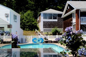 Seasonal outdoor pool, open 9 AM to 9 PM, pool umbrellas, sun loungers