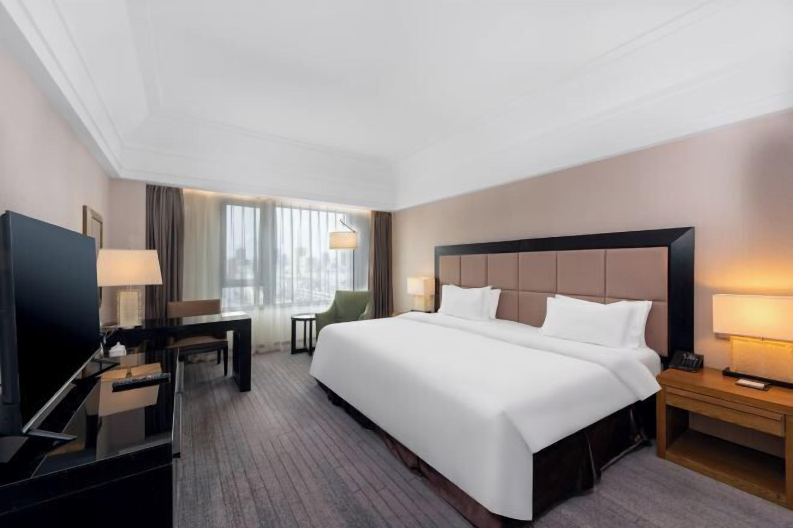 Premium bedding, down comforters, free minibar items, in-room safe