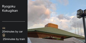 A modern building with a green roof and a unique architectural design.