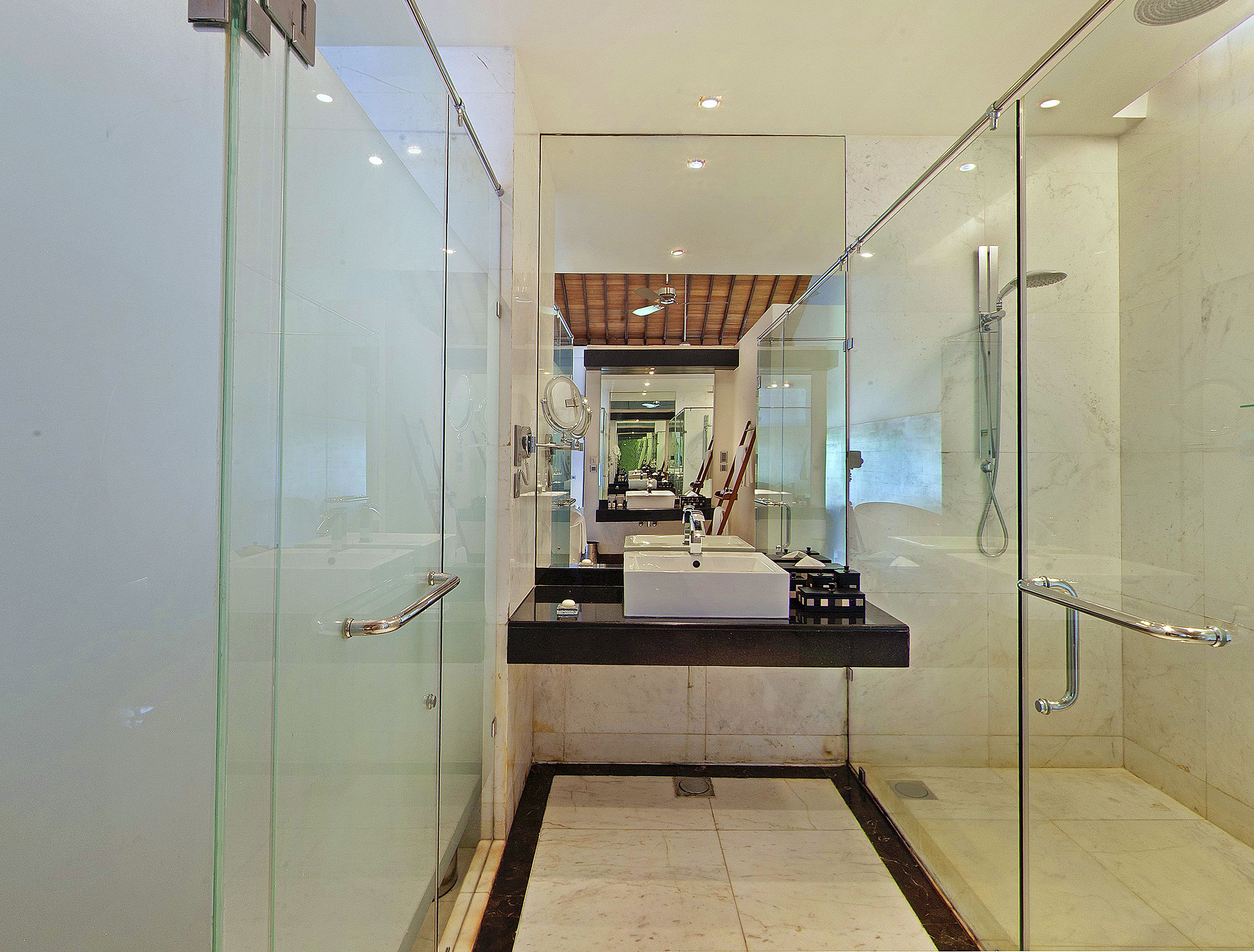 designer toiletries, hair dryer, bathrobes, slippers