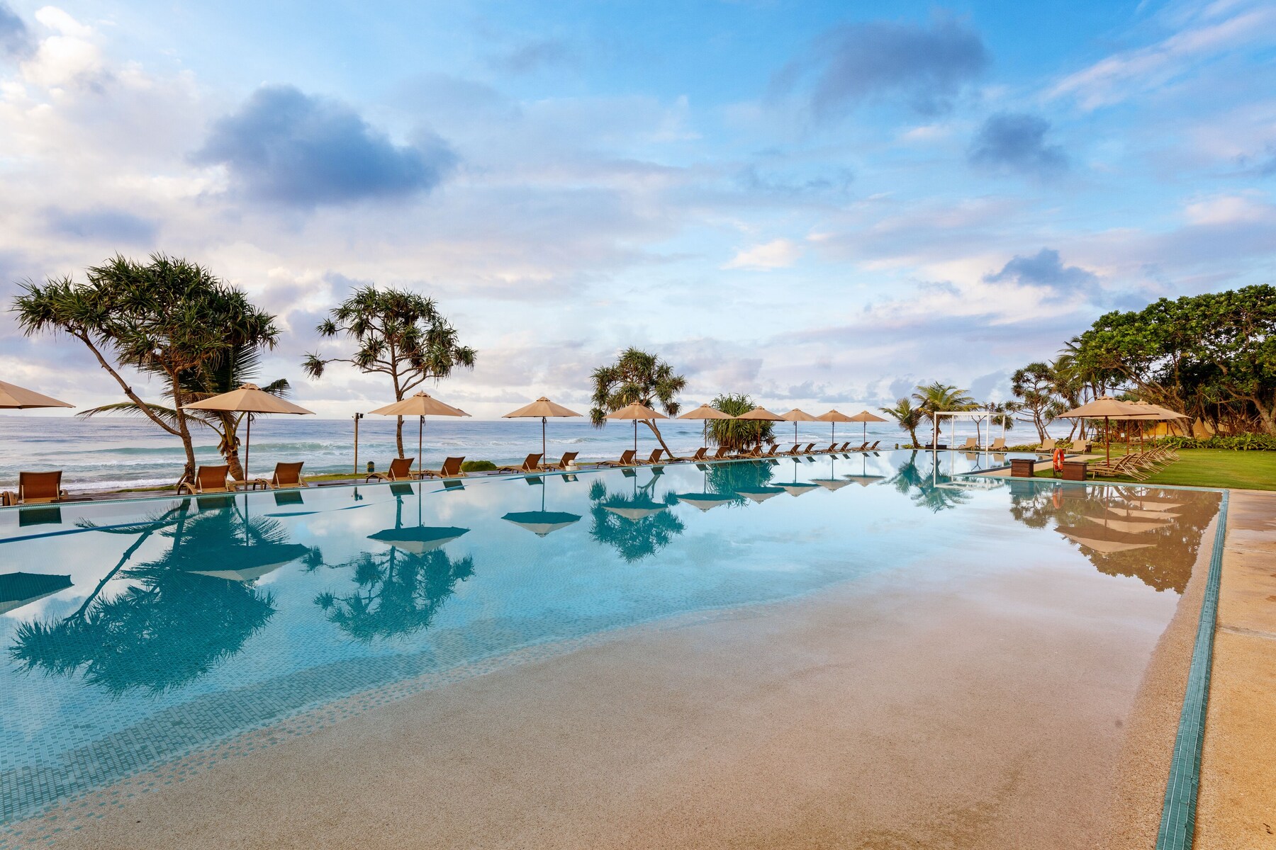 Indoor pool, outdoor pool, pool umbrellas, pool loungers