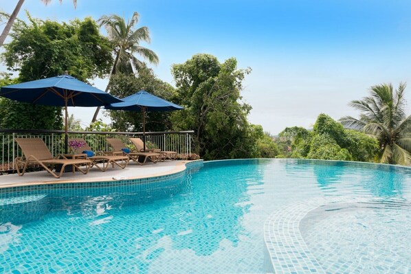 Outdoor pool, pool umbrellas, pool loungers