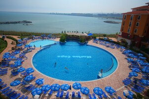 Seasonal outdoor pool, pool umbrellas, sun loungers