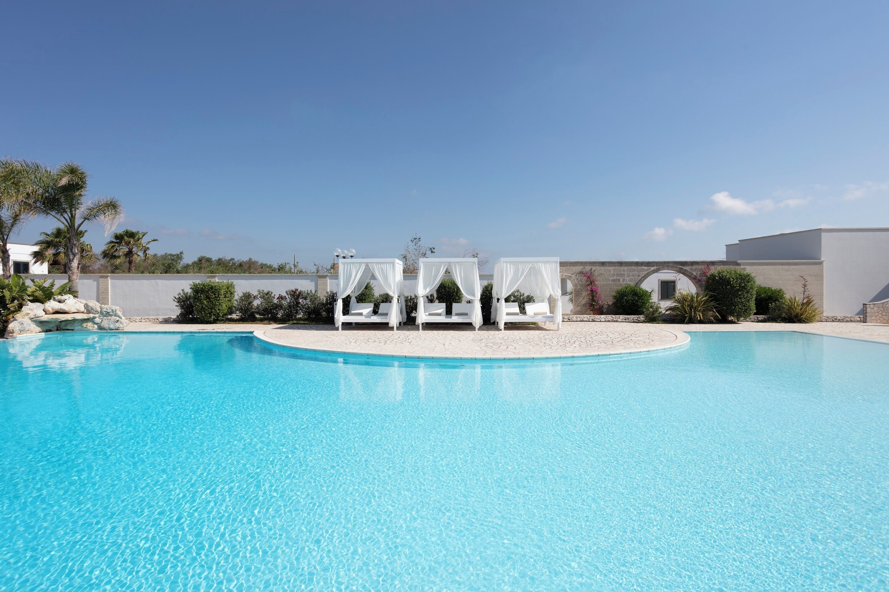 Outdoor pool, open 9:30 AM to 7:30 PM, pool loungers