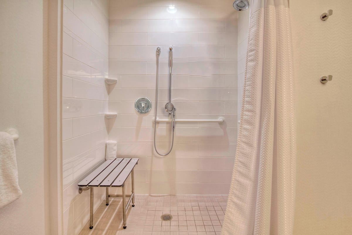 Designer toiletries, hair dryer, towels