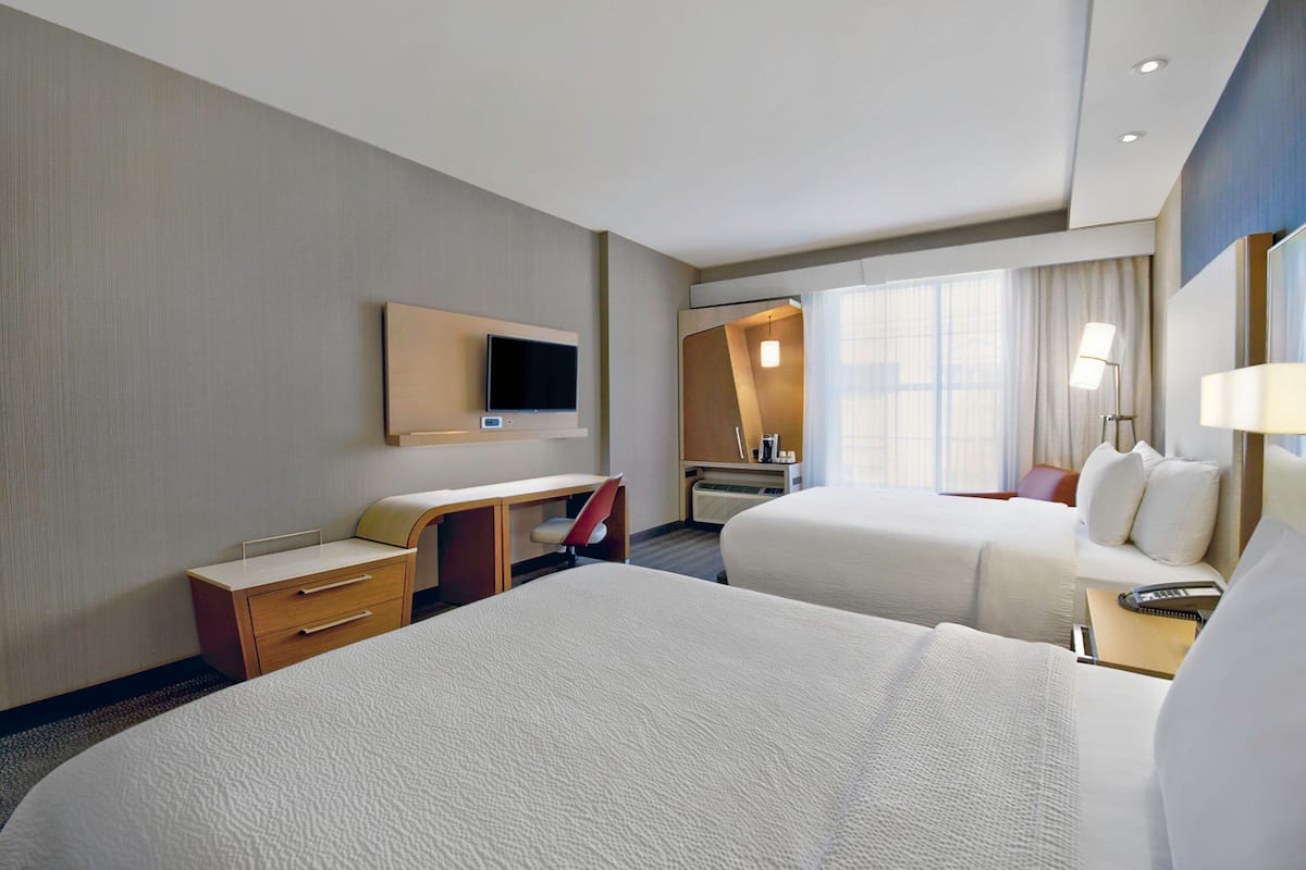 Hypo-allergenic bedding, pillow-top beds, in-room safe, desk