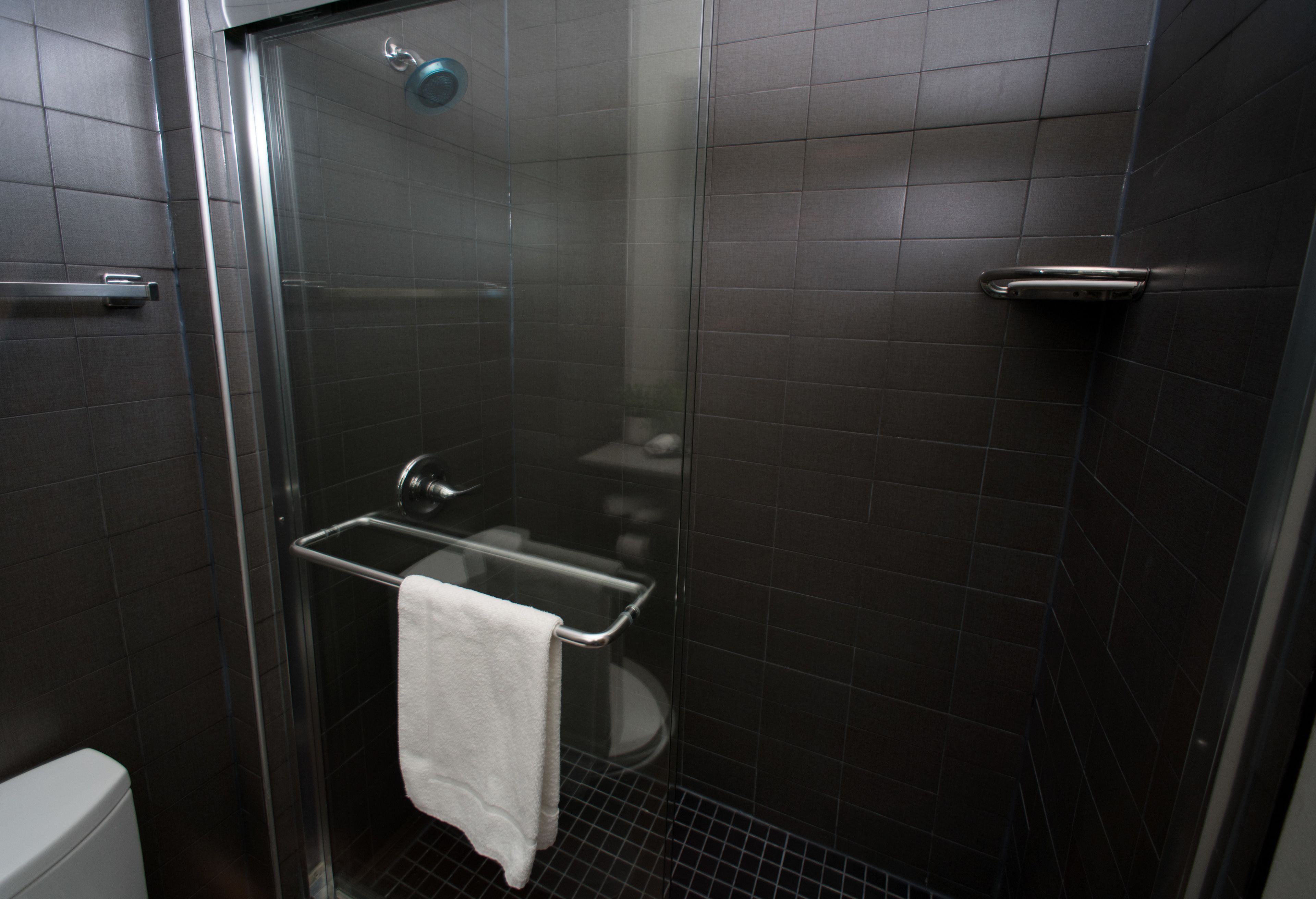 designer toiletries, hair dryer, towels, soap