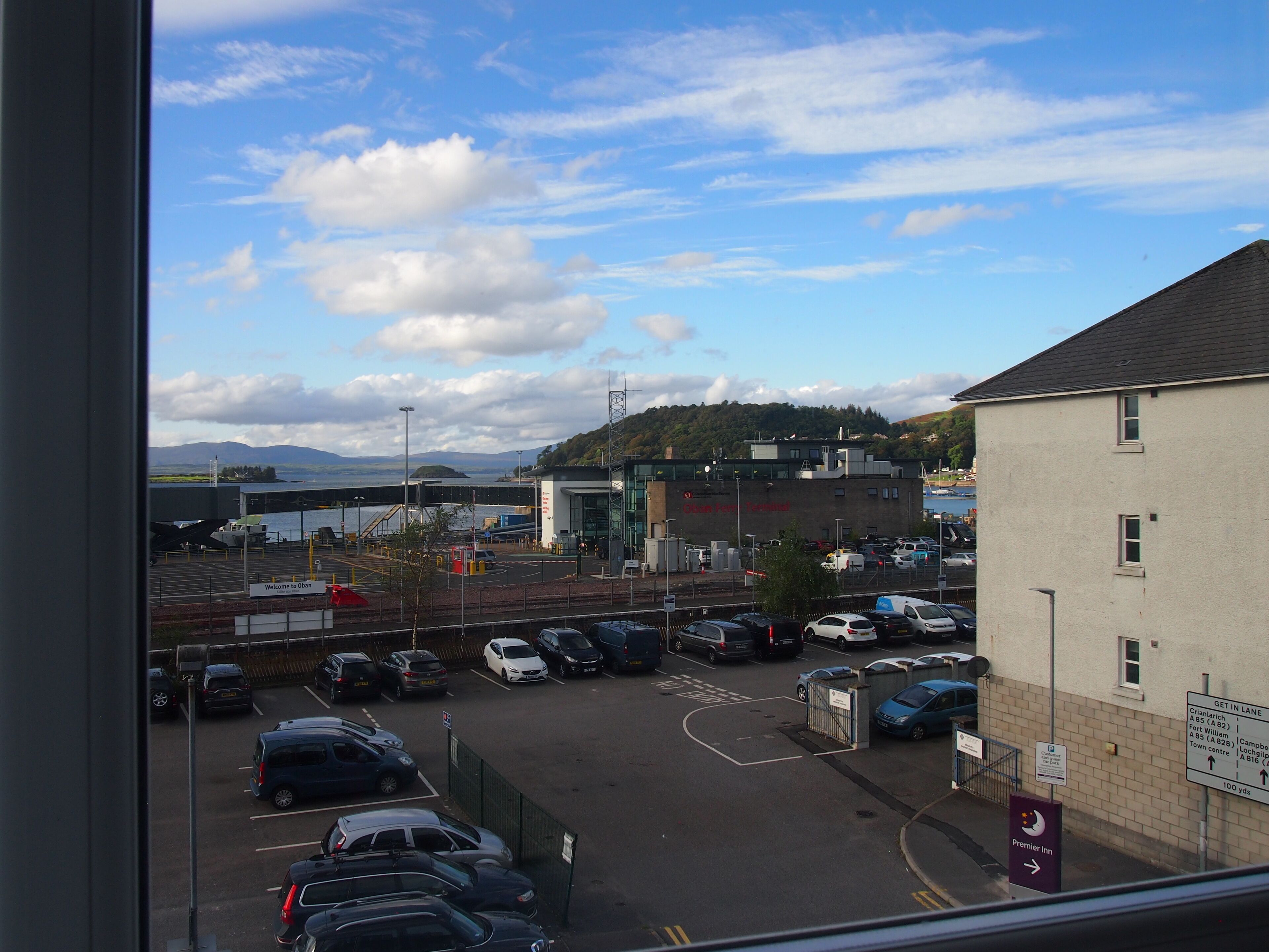 A parking lot with cars and a building labeled "Cranfield Technical."