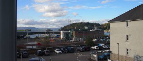 A parking lot with cars and a building labeled "Cranfield Technical."