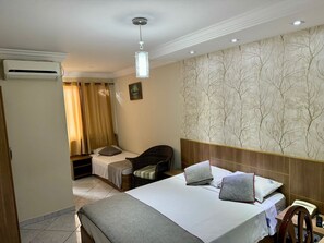 Family Room | Minibar, in-room safe, desk, laptop workspace