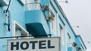 A sign for HOTEL BLUMENAU.