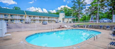 Seasonal outdoor pool, open 8:00 AM to 8:00 PM, pool umbrellas