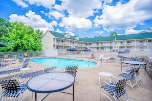 Seasonal outdoor pool, open 8:00 AM to 8:00 PM, pool umbrellas