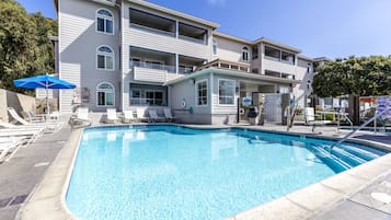 Outdoor pool, open 7:00 AM to 11:00 PM, pool umbrellas, pool loungers