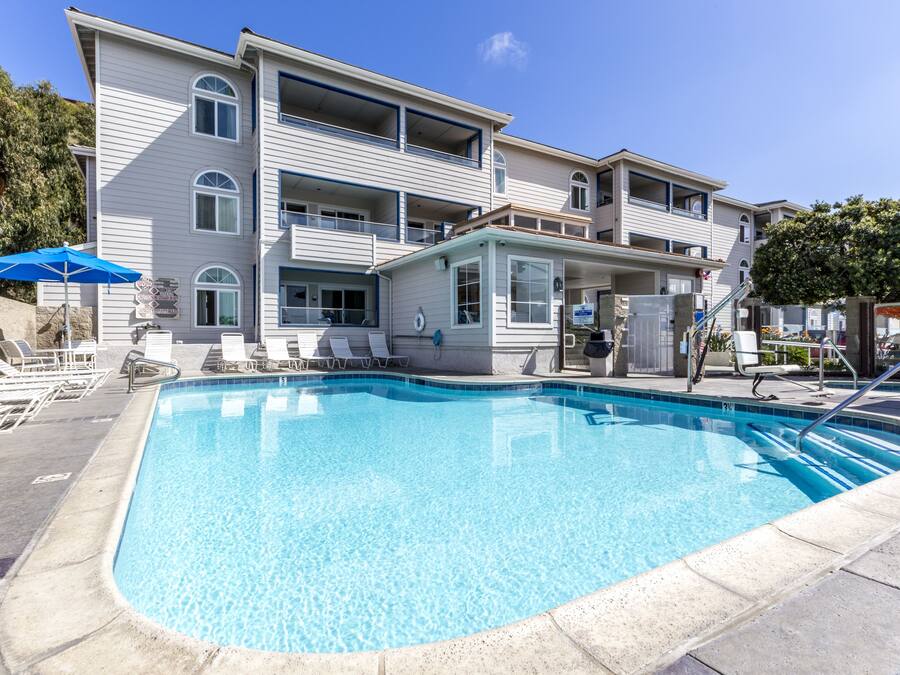 Outdoor pool, open 7:00 AM to 11:00 PM, pool umbrellas, sun loungers