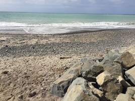 On the beach, sun loungers, beach umbrellas