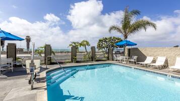 Outdoor pool, open 7:00 AM to 11:00 PM, pool umbrellas, pool loungers