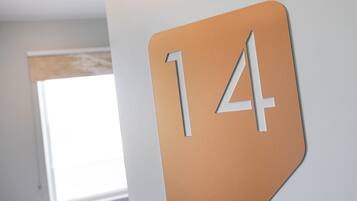 A wall with a large number '14' sign.